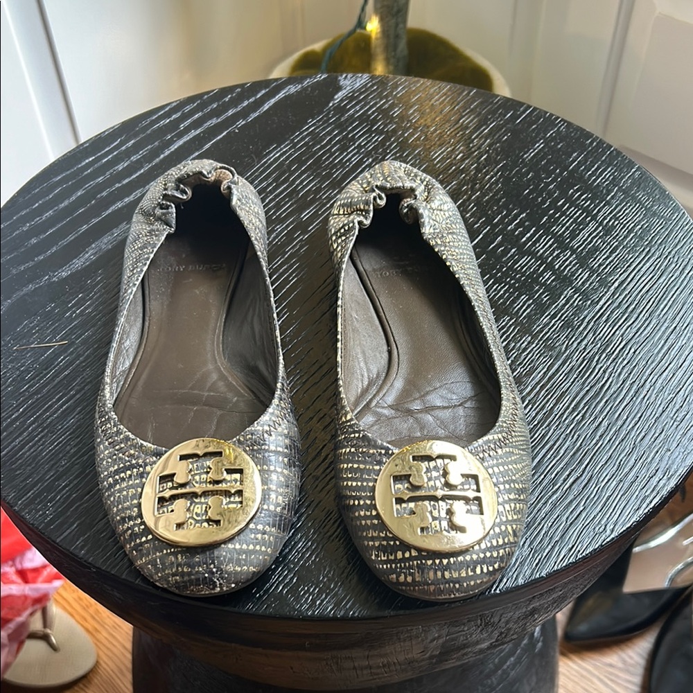 Tory Burch Black and Gold Flats with Logo Medallion